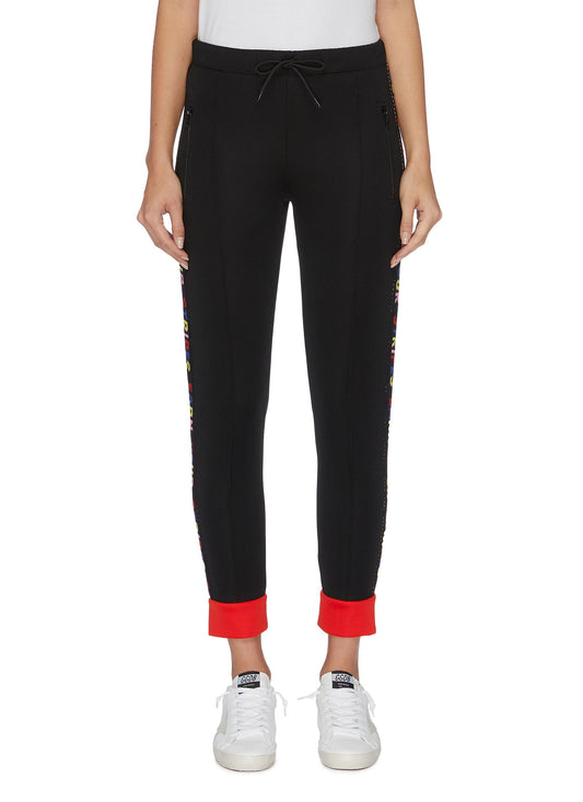 Earn Your Stripes' slogan embroidered outseam zip cuff ribbed track pants